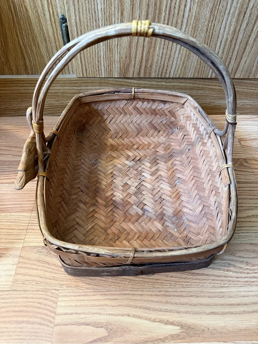 Vintage Zhejiang Chinese woven rattan and wood handled basket with a carved